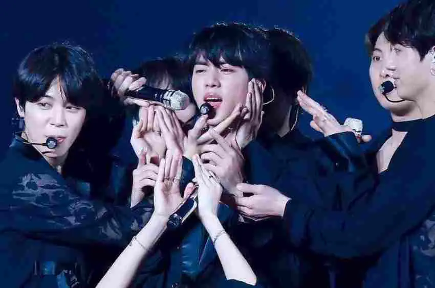 Check Out How Jin Takes Care of All BTS Members
